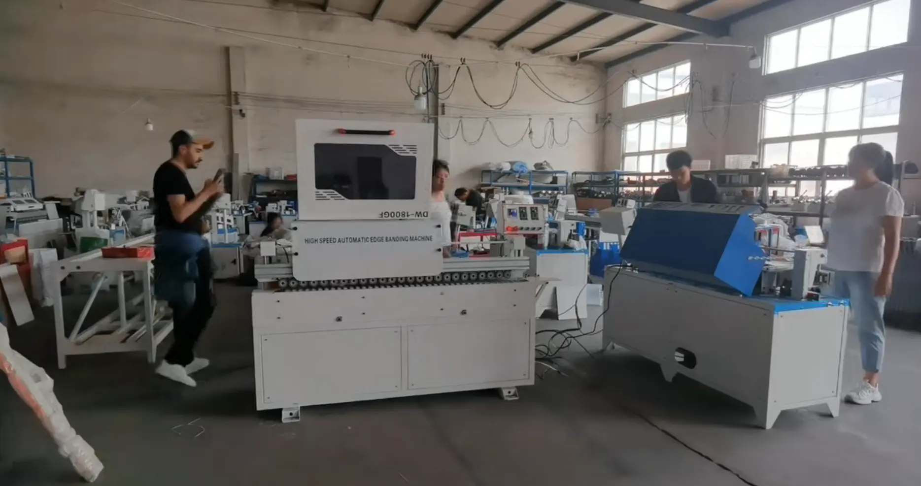 Overseas buyer inspecting machinery